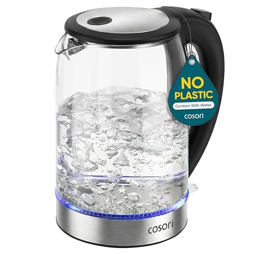 A borosilicate glass Cosori electric kettle with a black lid and handle on its base.
