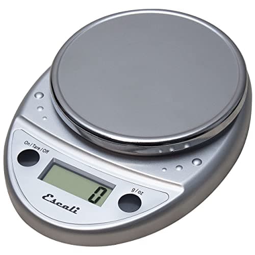 A chrome Escali Primo digital kitchen scale with a rounded platform and two sealed buttons.