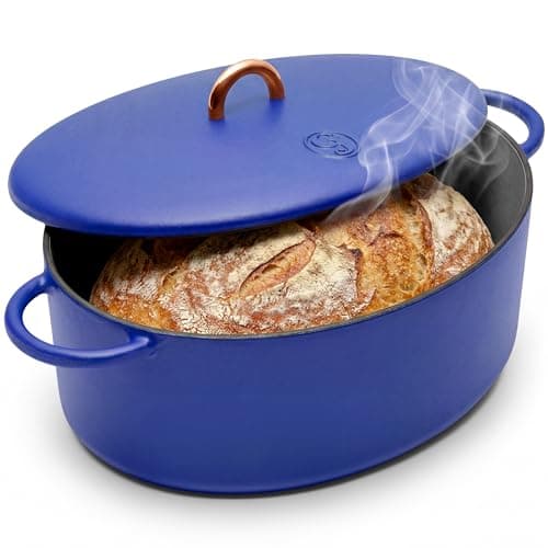 Great Jones Dutchess 6.75-quart enameled Dutch oven in pale blue with gold handles.