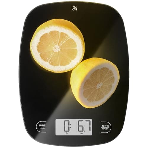 A slim black glass Greater Goods digital kitchen scale with a backlit display.