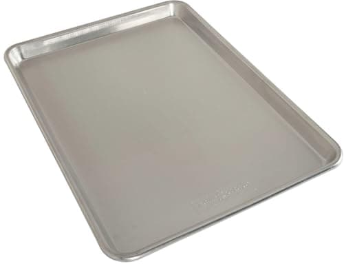 Nordic Ware natural aluminum half-sheet pan with rolled edges.