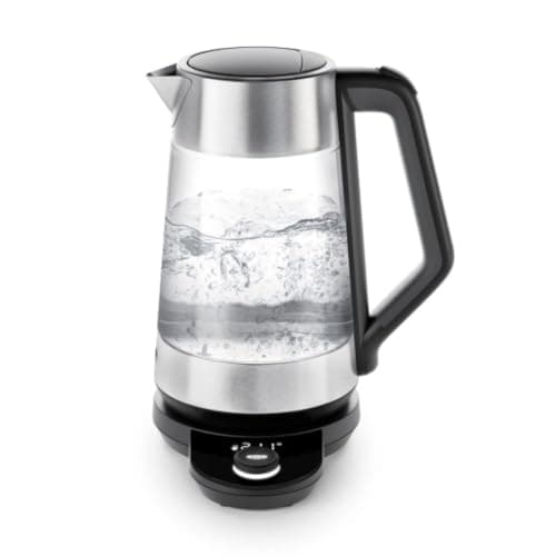 An OXO Brew glass and stainless electric kettle with a temperature dial and digital display on its base.