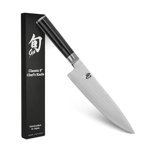 Shun Classic 8-inch chef's knife with a Damascus-clad blade and a dark Pakkawood handle.