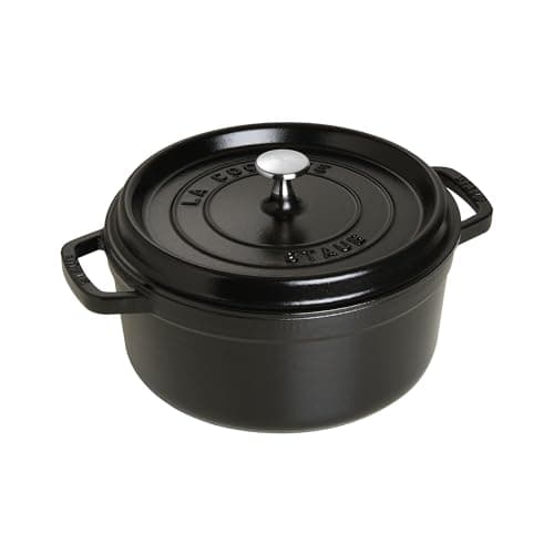 Staub 4-quart round cocotte in matte black enamel with brass knob.