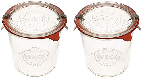 Six Weck glass mold jars with glass lids, rubber gaskets, and steel clamps.